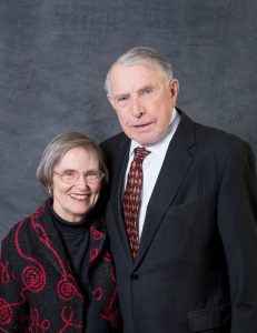 Martin and Sylvia Sabo pose for a picture in front of a dark backdrop 